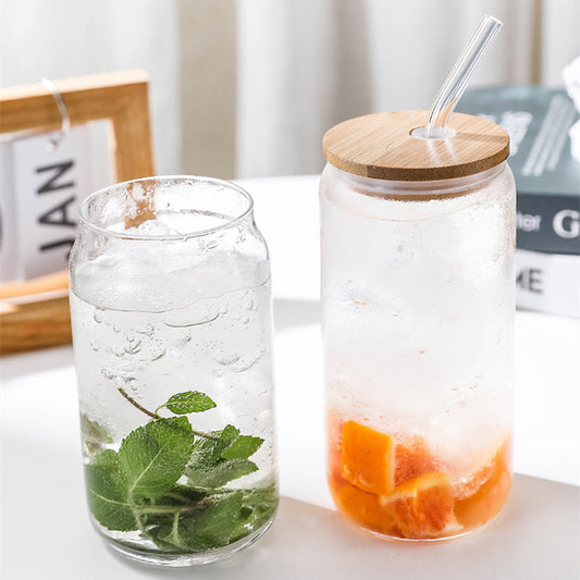 Modern can-shaped high borosilicate glass cup with a secure lid, showcasing a sleek transparent design with heat-resistant and insulating properties