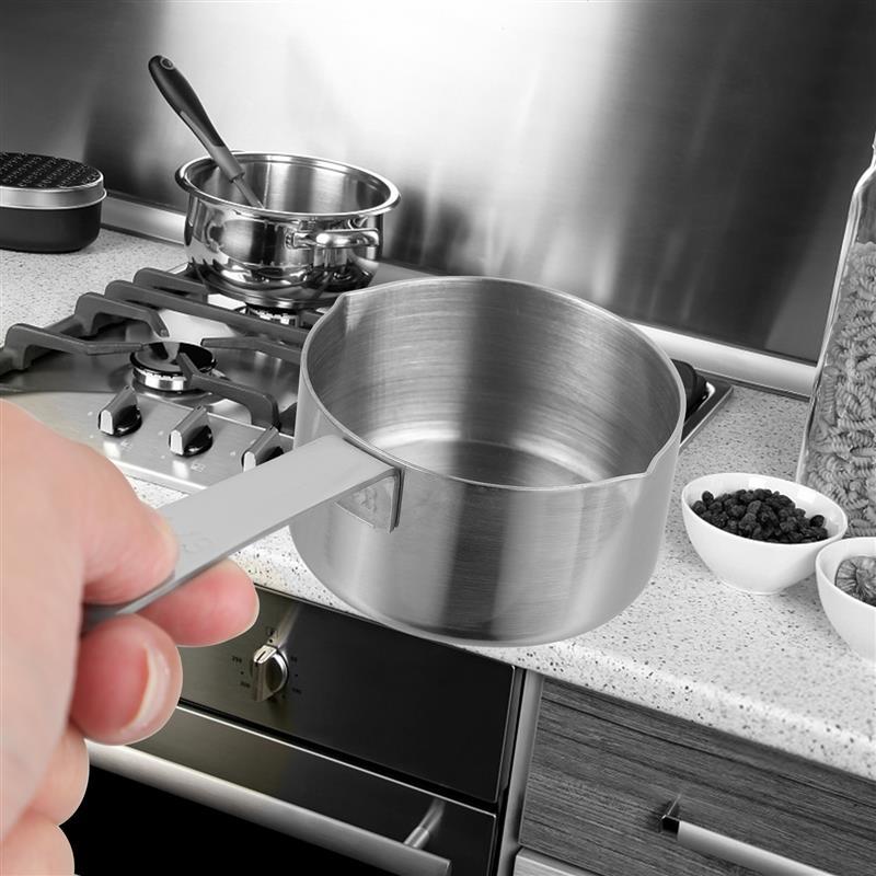 Image of the PrecisionBake Stainless Steel Measuring Cup, a sleek modern kitchen tool in a silver-gray finish featuring a bright, easy-pour mouth, available in 60ml and 80ml sizes for precise measurements.