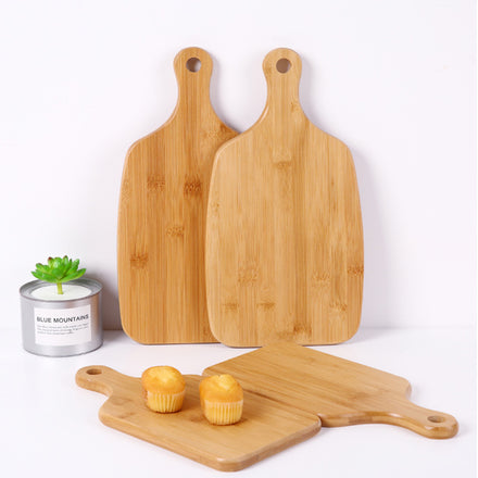 Modern minimalist wooden cutting board crafted from beech wood featuring an elegant bamboo and wood lacquer hanging handle, showcasing a natural finish and sleek design perfect for contemporary kitchens