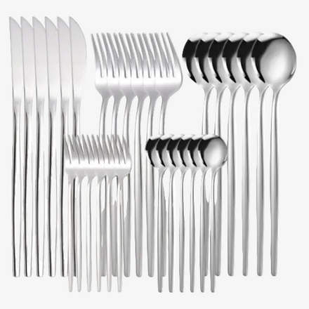 Set of silver cutlery including forks, knives, and spoons with a blue box in the background.